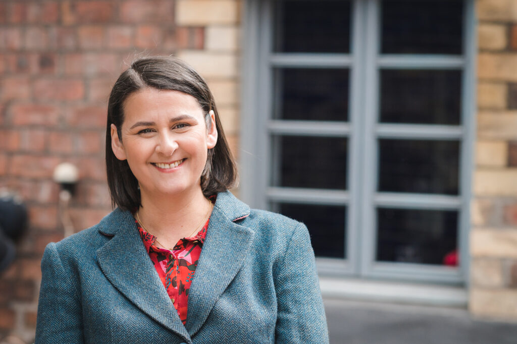 smiling woman in jacket